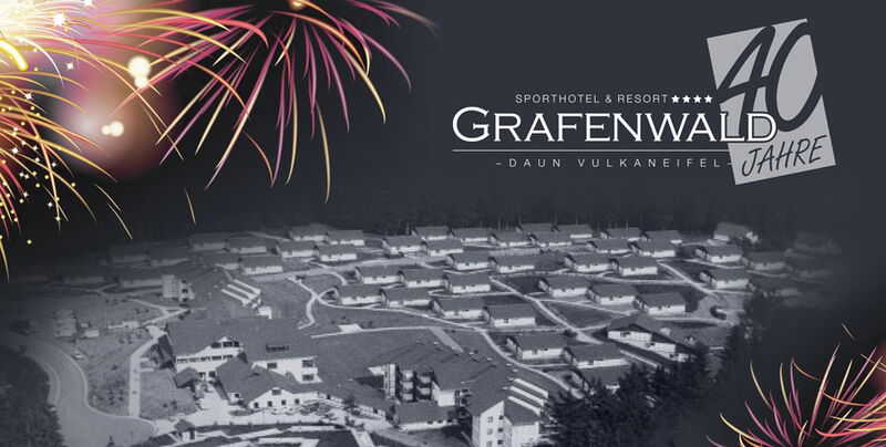 Jubiläumsartwork mit Feuerwerk, Blick über den Ferienpark und 40 Jahre Grafenwald Logo